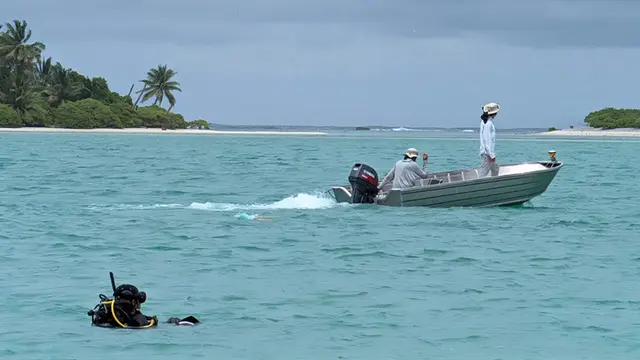Members of the Amelia Earhart expedition preparing for an underwater survey