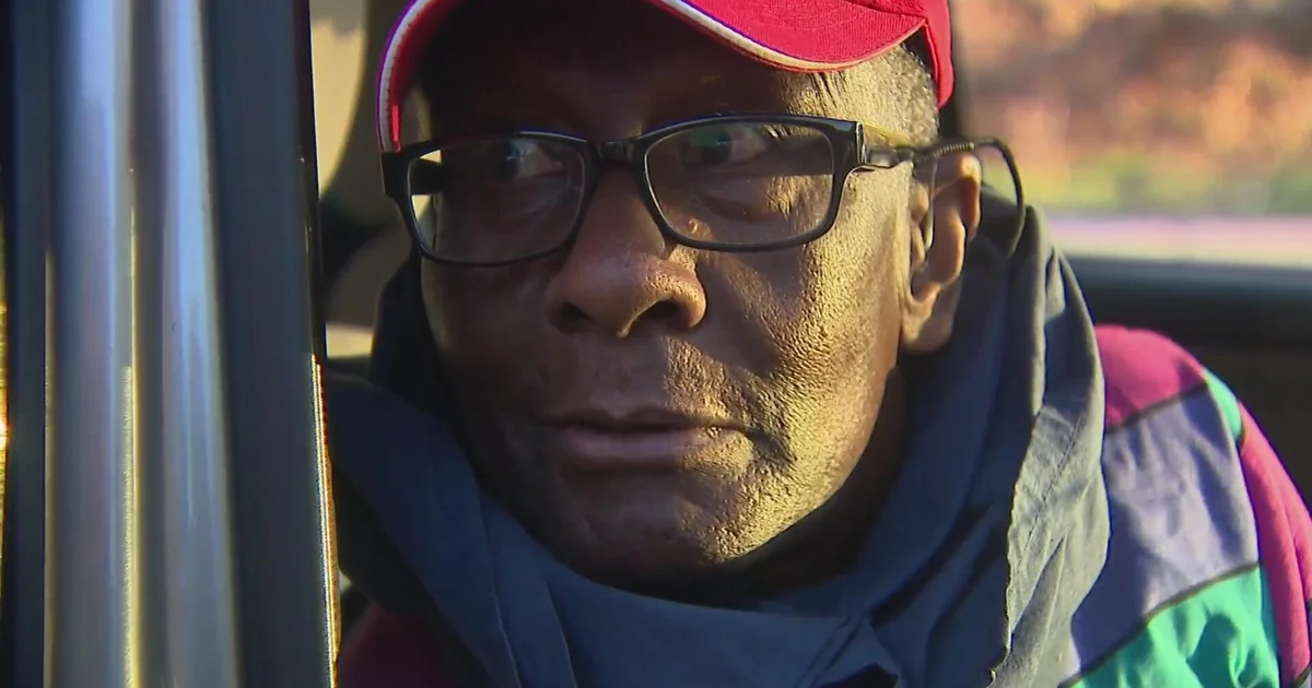 Rev. Edward Nalwamba, 78, sits in a vehicle after his release from ICE detention in Aurora, Colorado, on Oct. 20, 2026