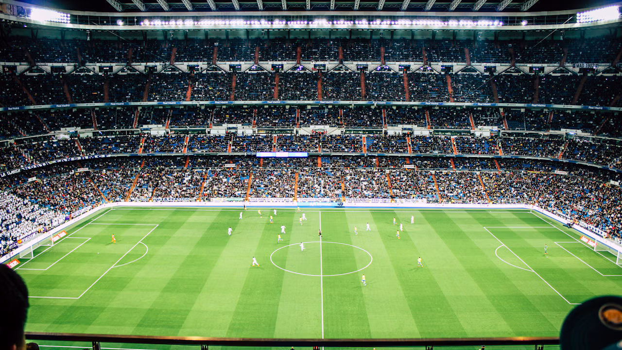 Floodlit football stadium and pitch, illustrating the PSG-Lyon Ligue 1 match