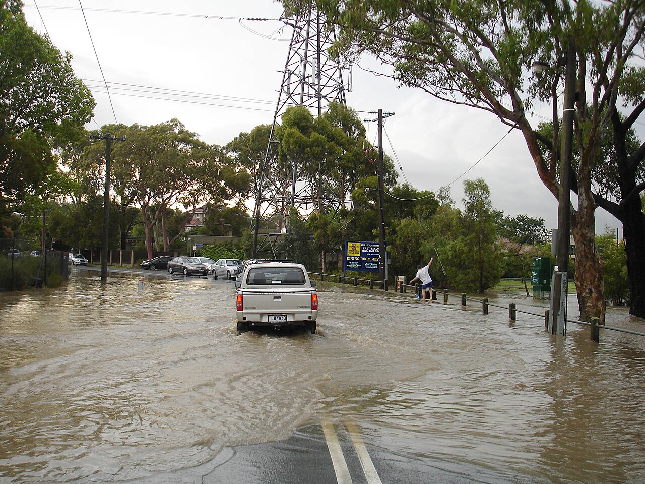A car drives through a flooded road in a 2007 file photo from Melbourne, Australia, shown for illustration only