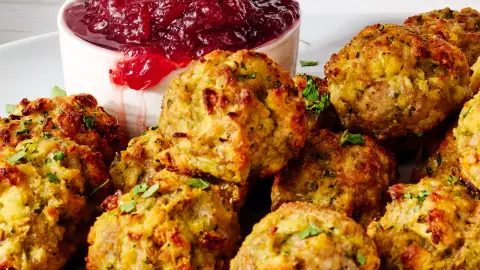 crispy stuffing bites with cranberry dip as a finished dish ready to serve.