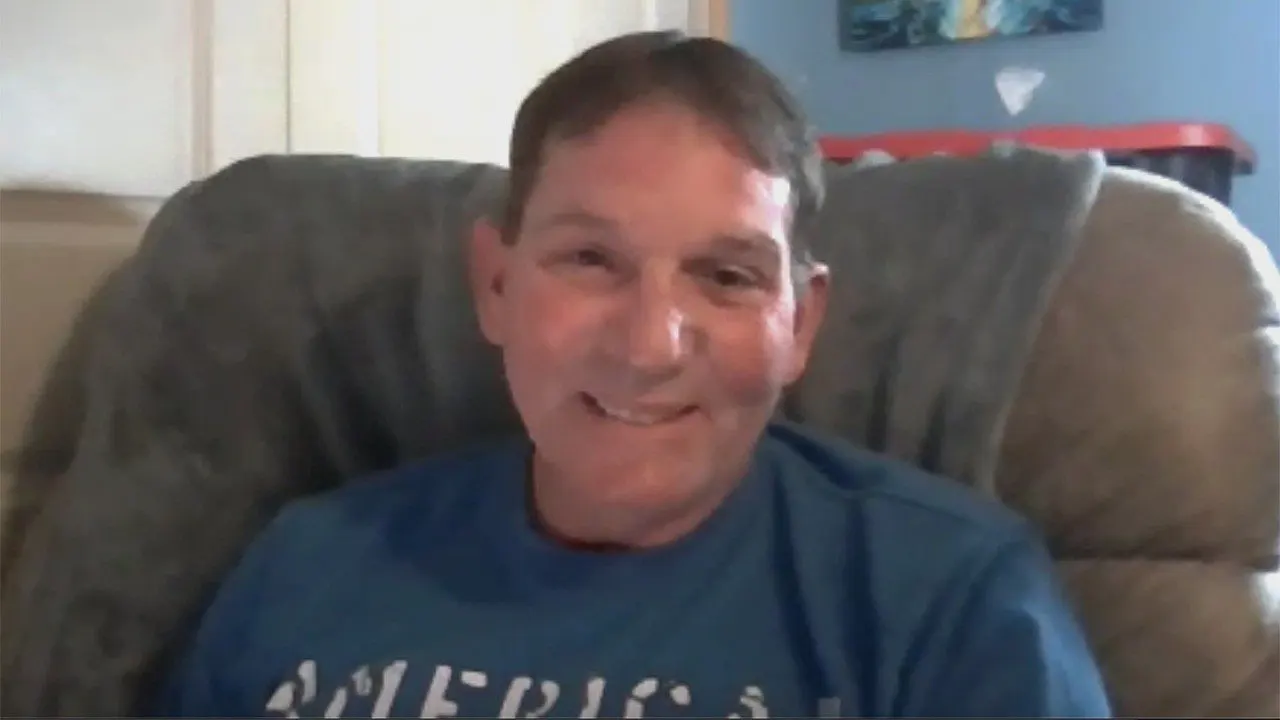 Kenneth Card speaks from a chair in a Fox News interview about his Texas Roadhouse steak complaint