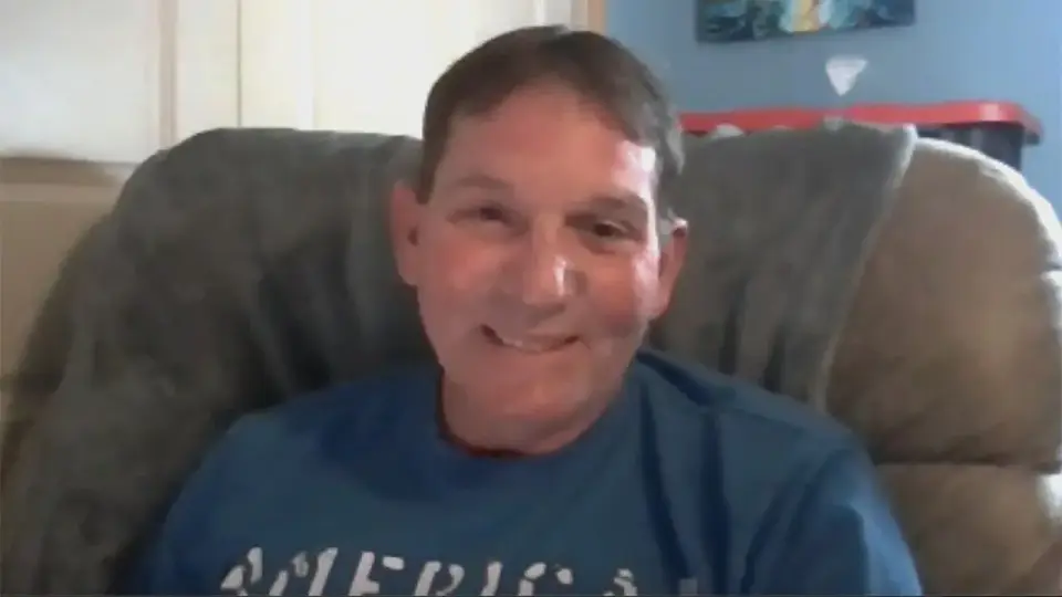 Kenneth Card speaks from a chair in a Fox News interview about his Texas Roadhouse steak complaint