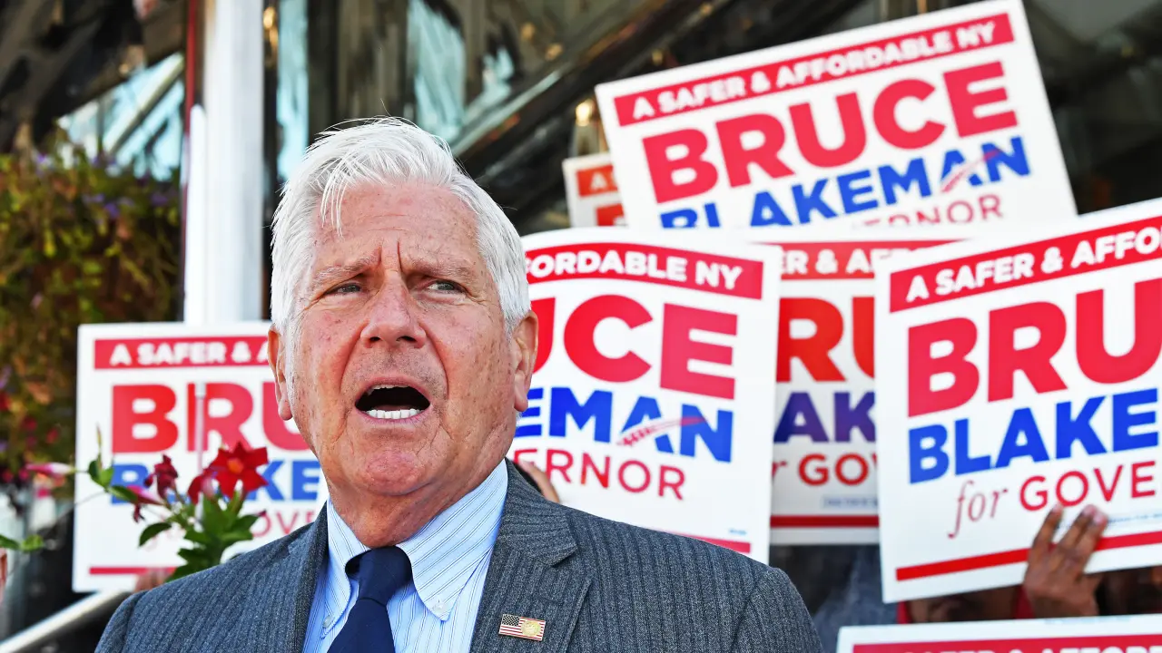 Bruce Blakeman speaks at a Bronx campaign stop on October 22, 2026, with campaign signs behind him.