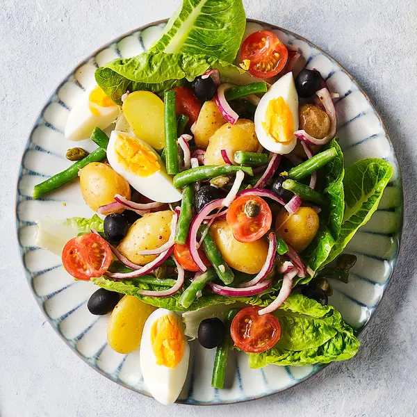 A prepared serving of vegetarian niçoise salad