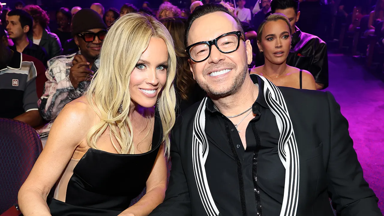 Jenny McCarthy and Donnie Wahlberg pose together at the 2026 iHeartRadio Music Awards.