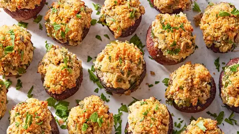 Baked mushroom caps filled with herbs, cheese and golden breadcrumbs
