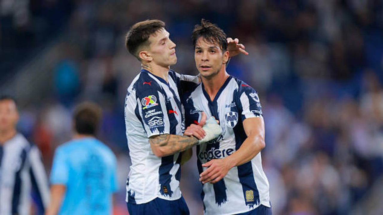 Óliver Torres celebrates a goal with a Monterrey teammate during the earlier April 2026 Liga MX meeting with Puebla; archival image, not from the Oct. 21 match.