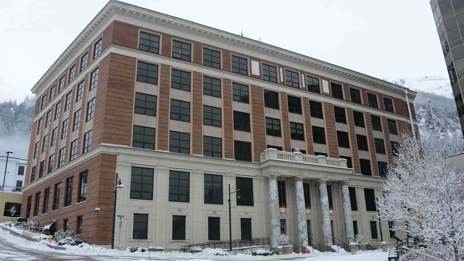 Snow-covered Alaska State Capitol in Juneau, where state officials oversee the election process; archival photograph from 2021.