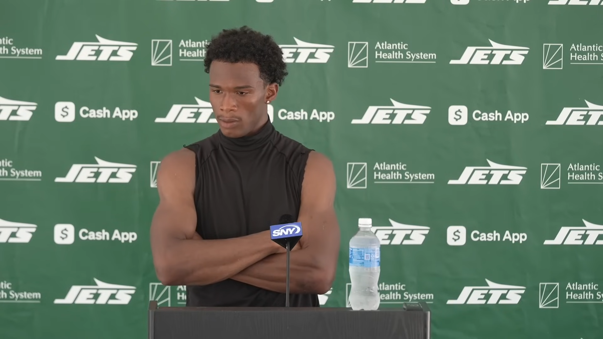 Garrett Wilson speaks to media at New York Jets training camp in July 2025; this file photo is not from the Dolphins game or the sideline exchange.