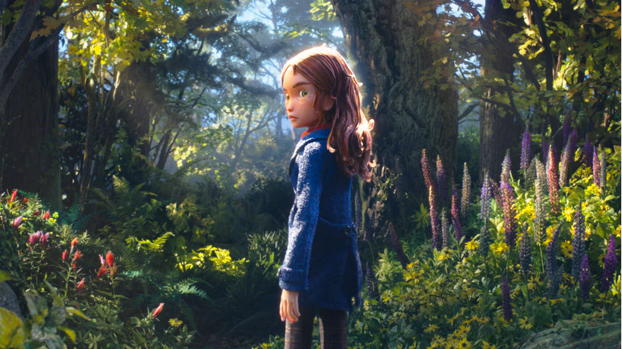 Prue McKeel stands in a sunlit forest in a still from Laika’s Wildwood.
