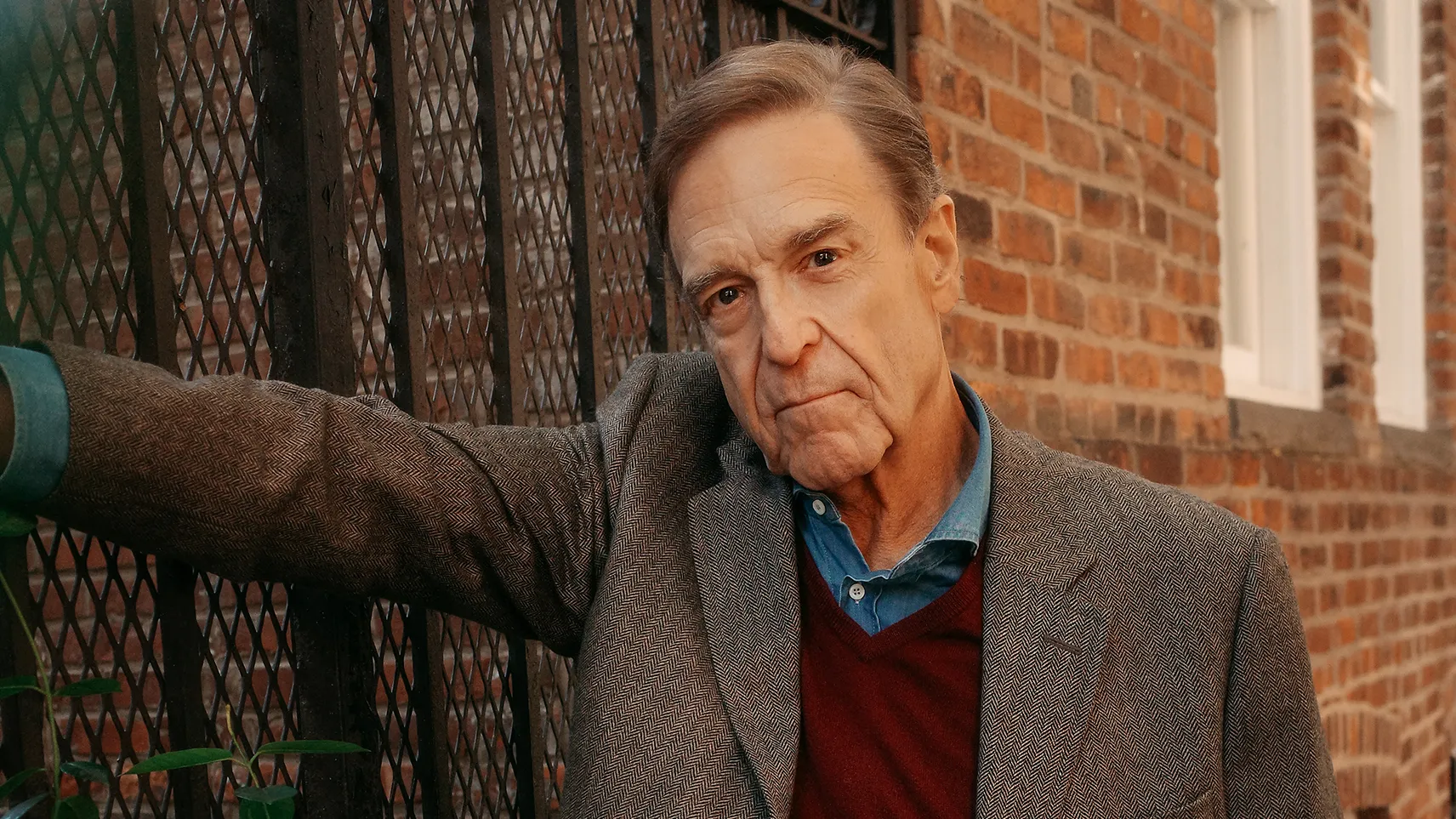John Goodman stands outside at his home in Charleston in a photograph accompanying his October 2026 New Yorker interview.