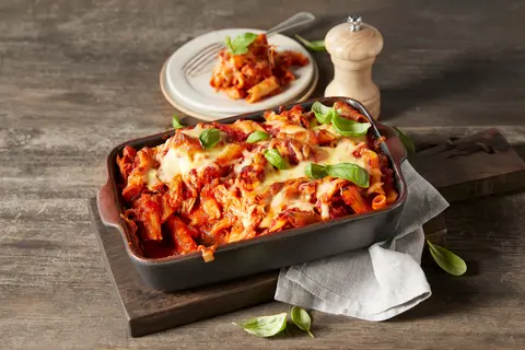 A prepared serving of basil-tomato chicken pasta bake
