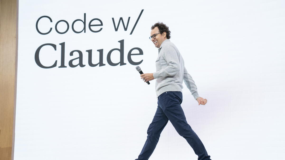 Anthropic CEO Dario Amodei speaking beneath a Code with Claude banner at the company’s developer conference