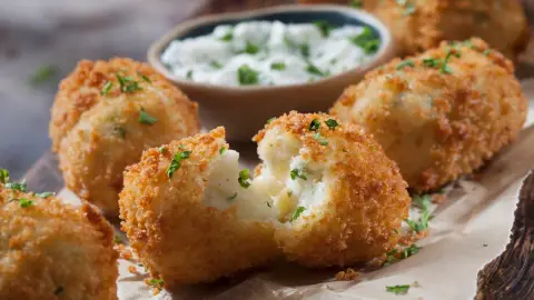 cheesy mashed-potato croquettes as a finished dish ready to serve.