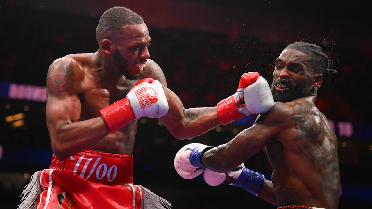 Frank Martin lands a punch during a super lightweight boxing bout