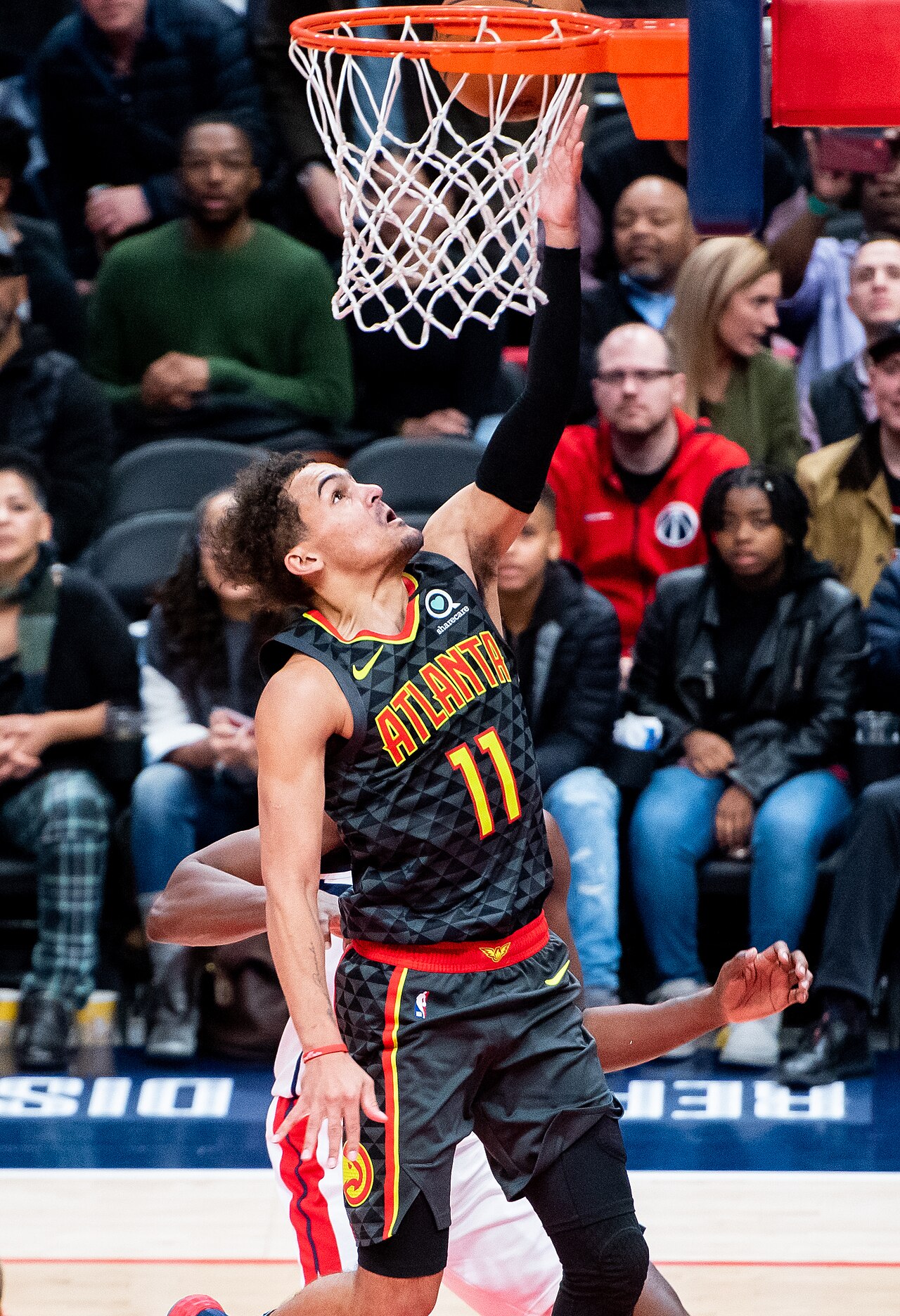 Trae Young handles the ball during an NBA game.
