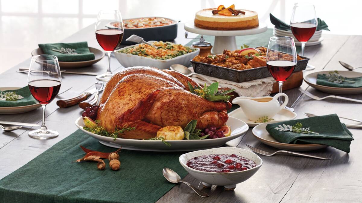 Roasted vegetables and classic Thanksgiving sides arranged on a holiday table