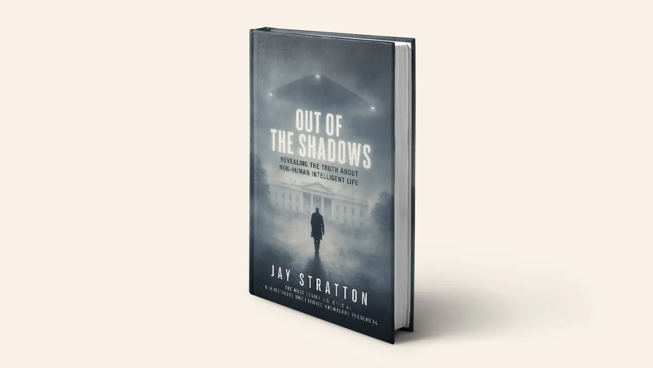 Hardcover edition of Out of the Shadows by Jay Stratton, with a figure walking toward the White House beneath a triangular craft in fog
