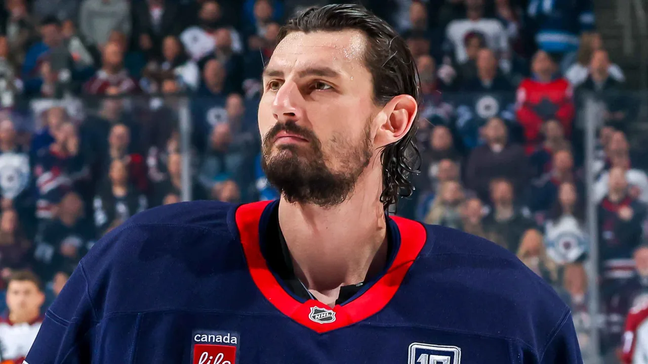 Winnipeg Jets goaltender Connor Hellebuyck in a close-up portrait without his mask