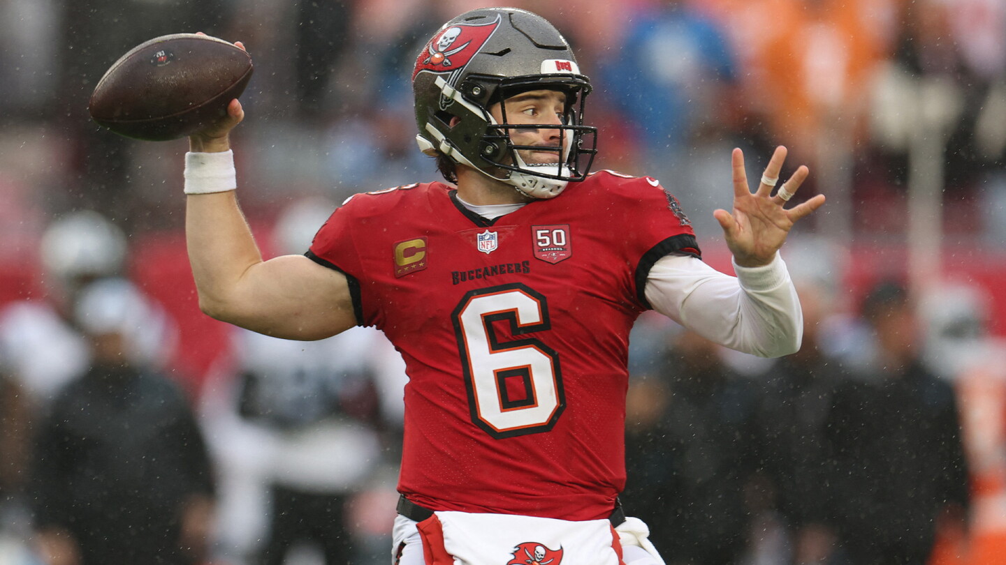 Baker Mayfield, in a Tampa Bay Buccaneers No. 6 jersey, prepares to throw during a game.