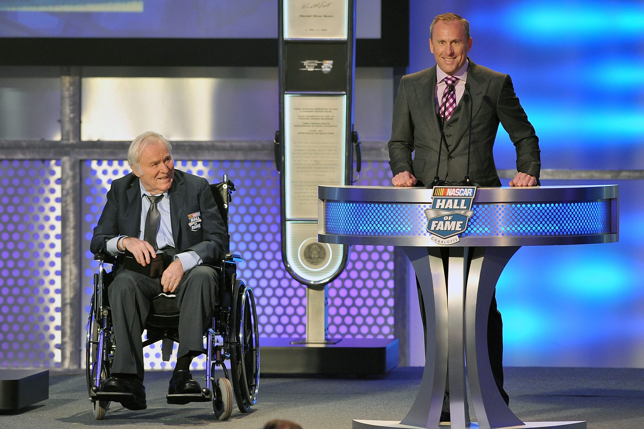 Fred Lorenzen looks on as his son Chris speaks at the 2015 NASCAR Hall of Fame induction ceremony in Charlotte, North Carolina