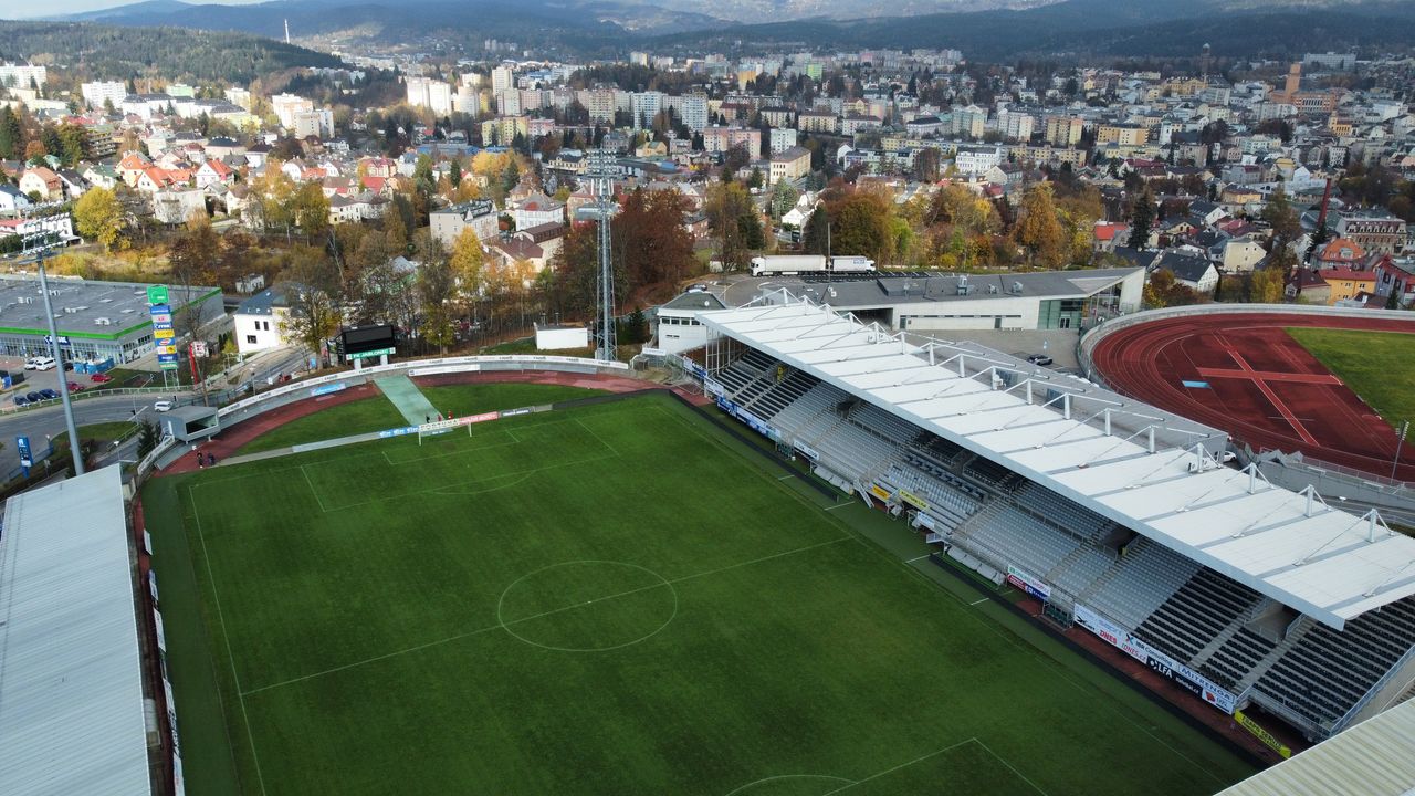 Aerial view of Stadion Střelnice, home of FK Jablonec, with the pitch and covered stand visible.