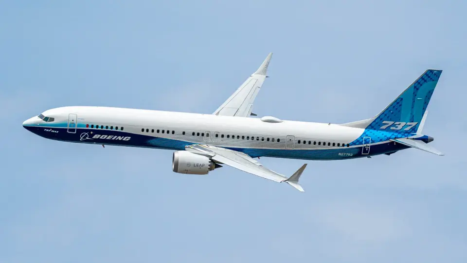 Boeing 737 MAX test aircraft in flight in blue-and-white livery