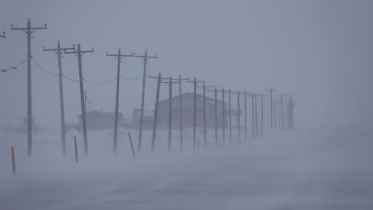 Blowing snow reduces visibility on a road near Kotzebue, Alaska.