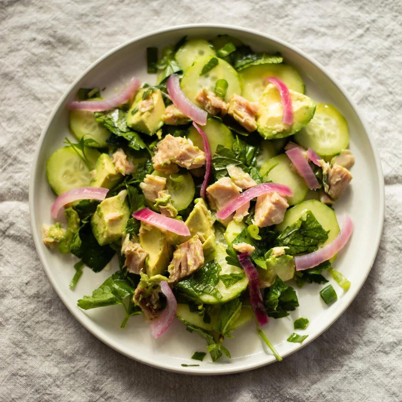A prepared serving of pickled tuna and cucumber salad