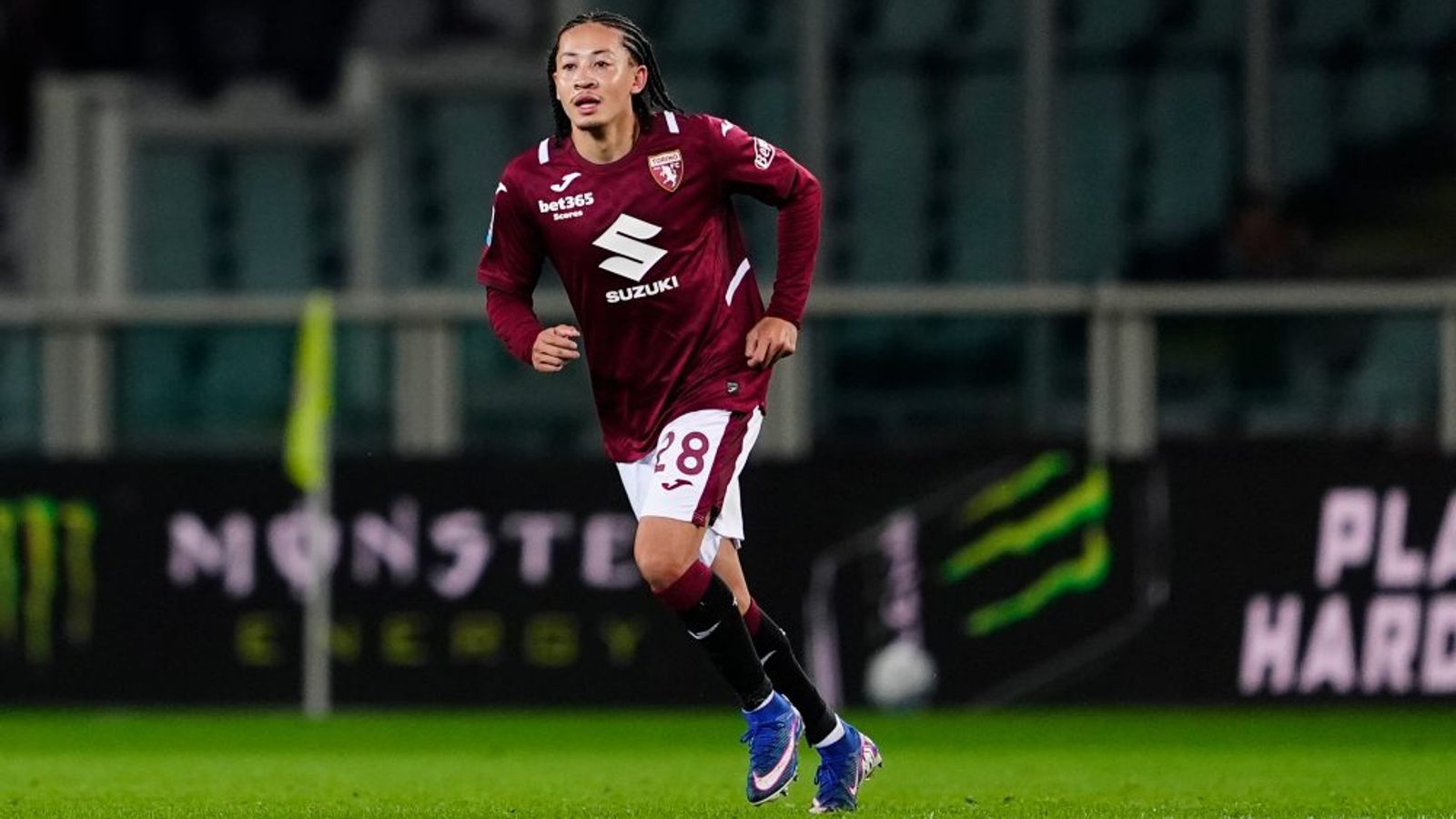 Torino and Monza players contest the ball during their Serie A match