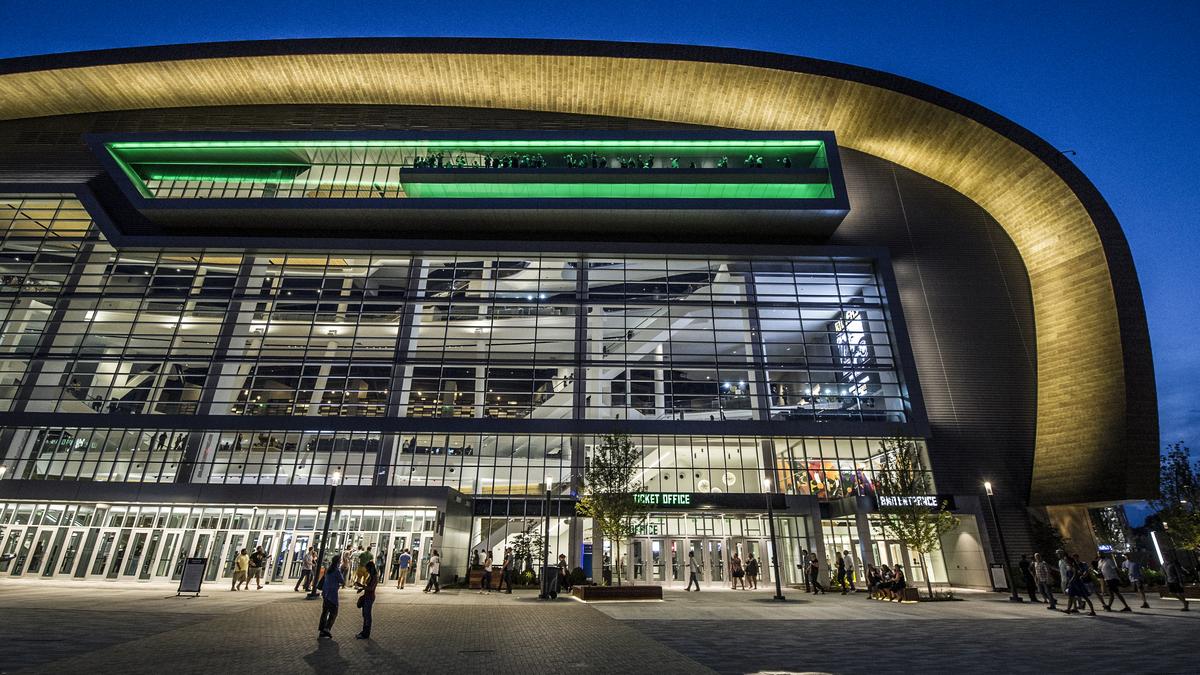 Exterior of Fiserv Forum in Milwaukee, the home arena of the Bucks, illuminated in the evening
