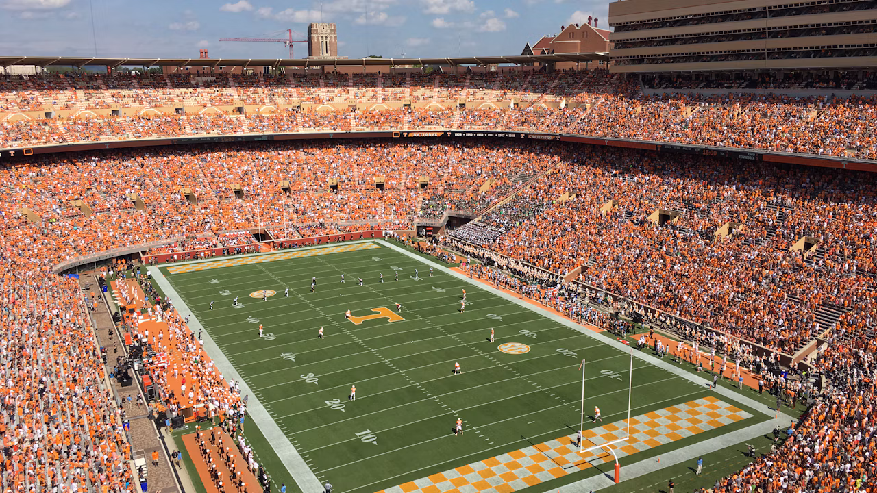 A packed college football stadium during a daytime game, used to illustrate Oregon's midseason coaching change.