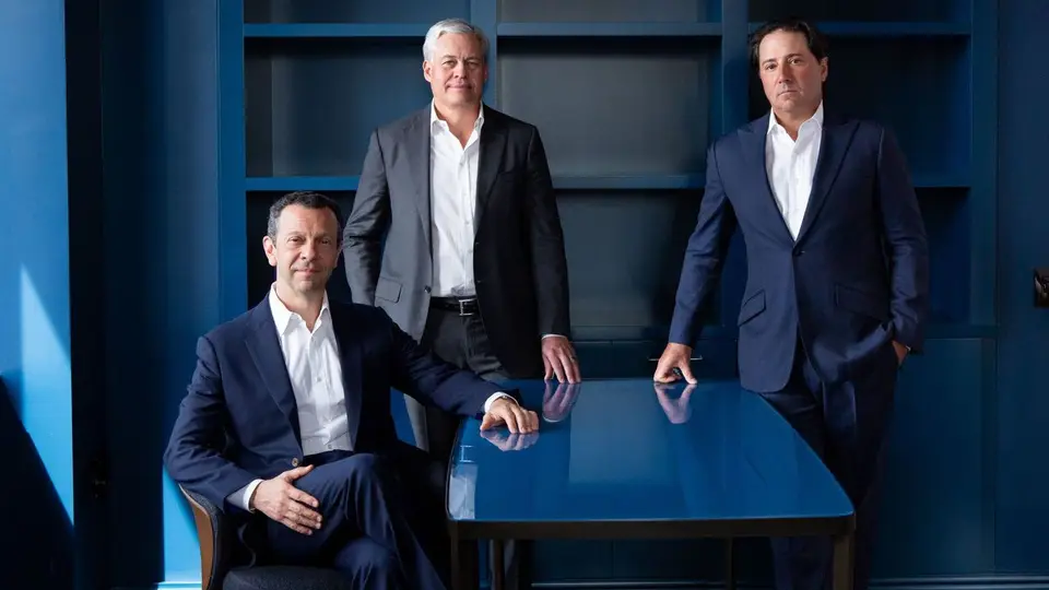 Ares Management executives meet around a conference table at the firm's headquarters.