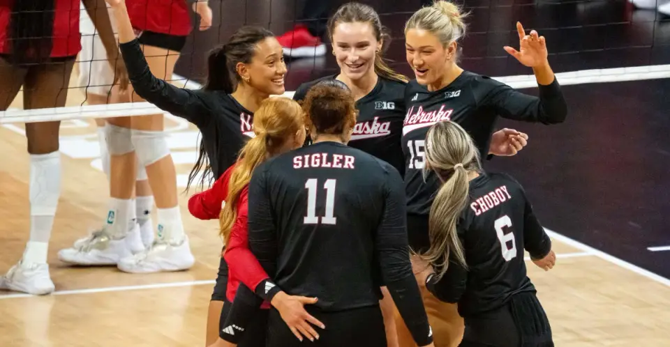 Nebraska players celebrate during a volleyball match at the Bob Devaney Sports Center in October 2026.