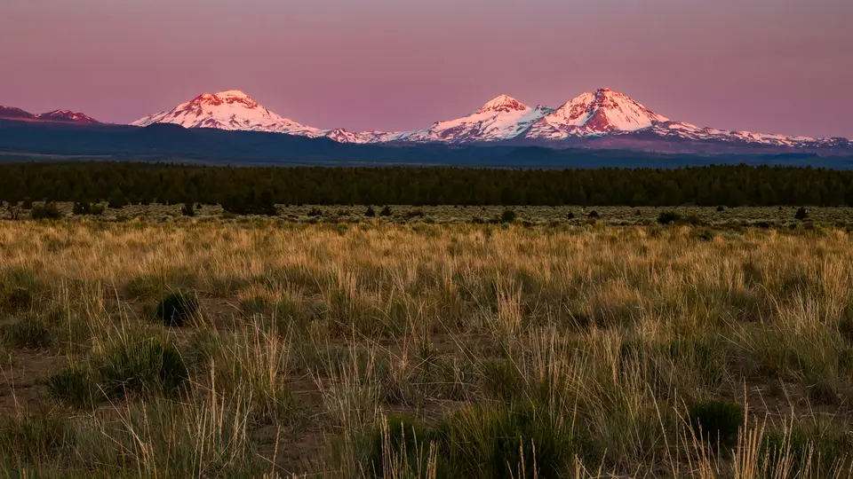 Three Sisters peaks in Central Oregon near Bend, an illustrative landscape unrelated to the school