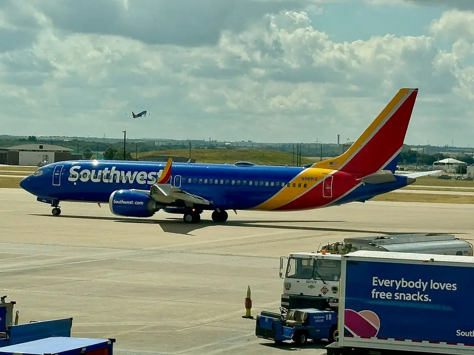 A Southwest Airlines Boeing 737 MAX 8, registration N8891Q, taxiing on an airport apron in the airline's blue, red and yellow livery