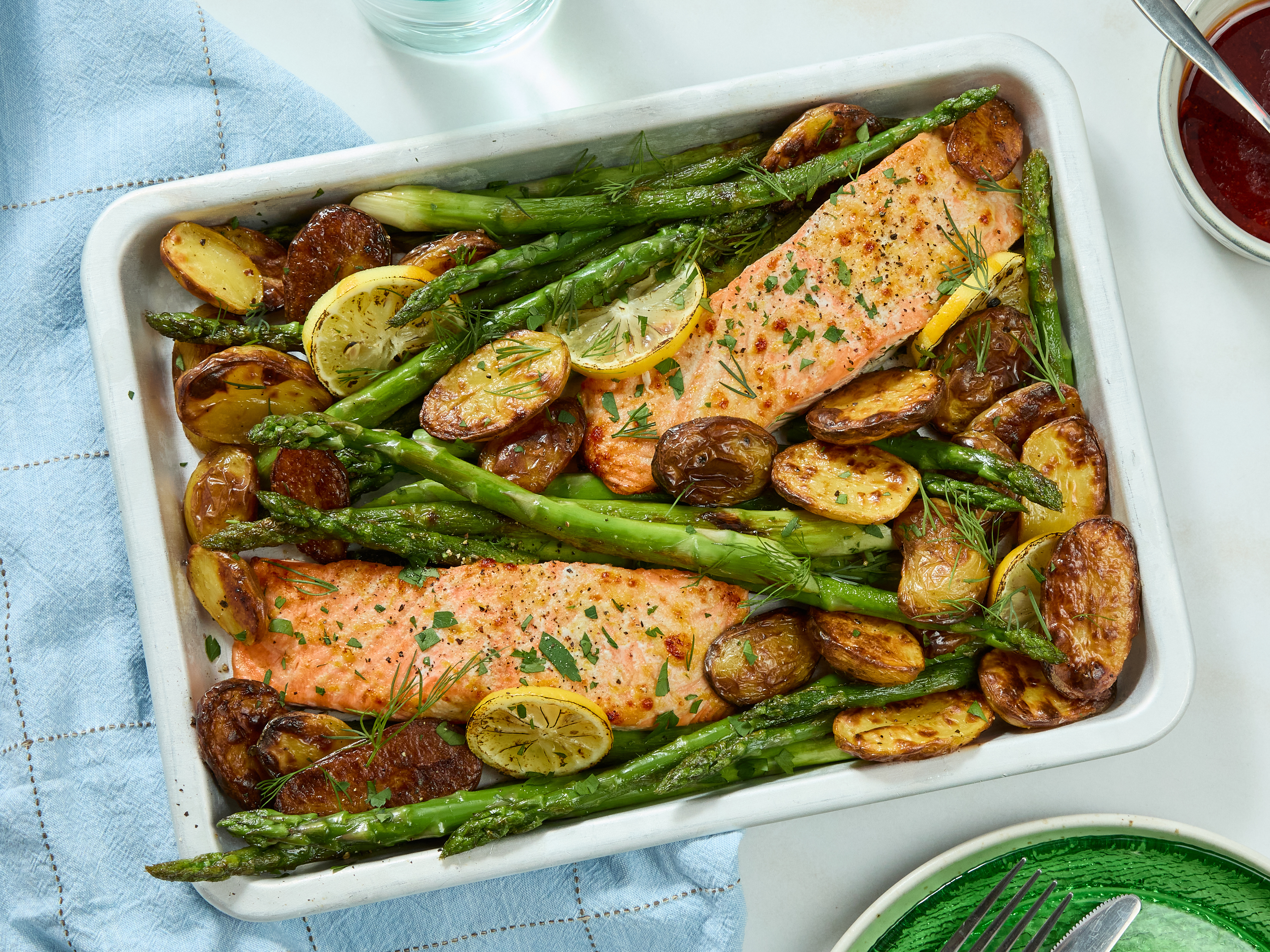 A prepared serving of garlic-lemon salmon with potatoes and asparagus