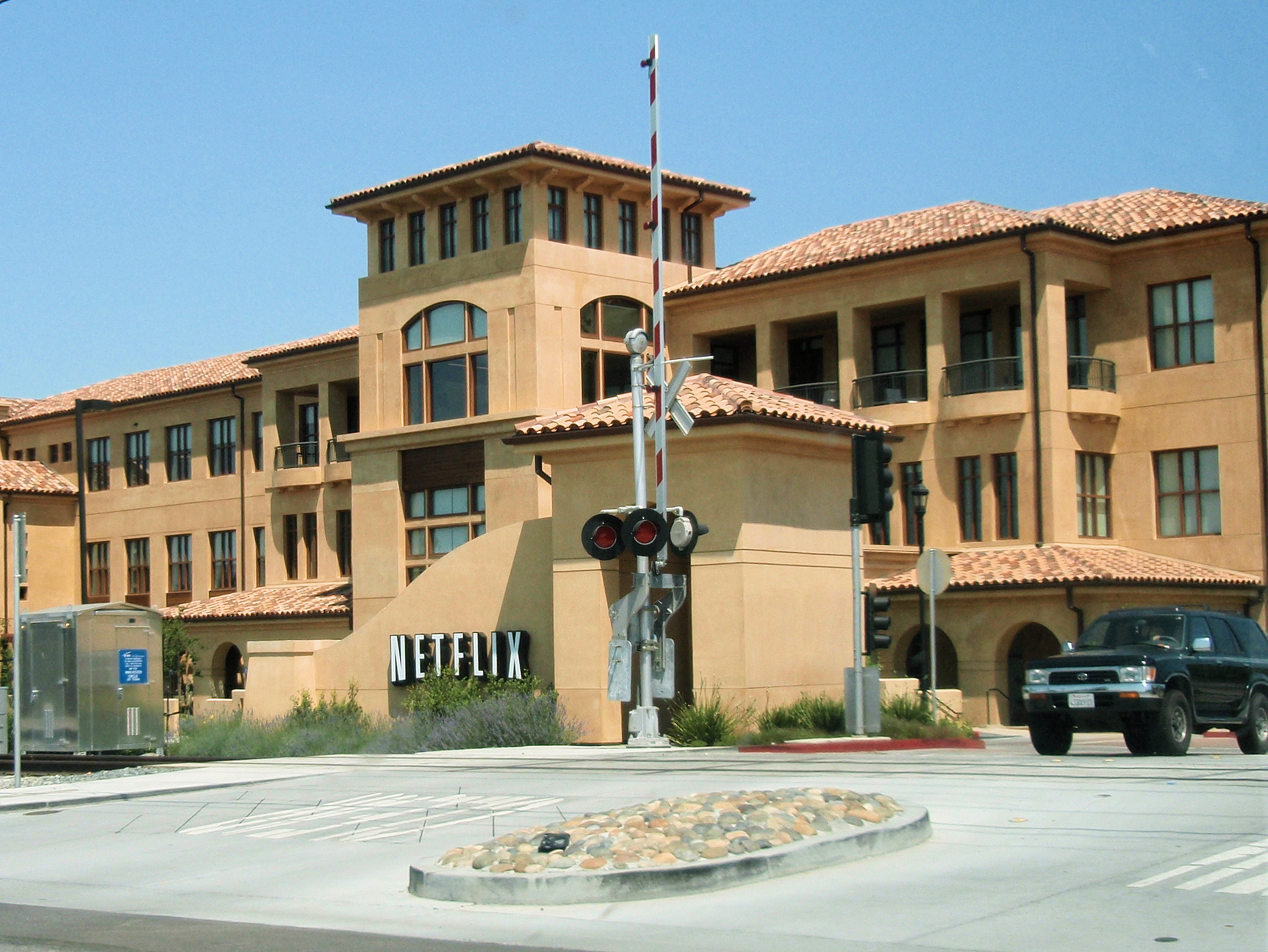 File photo of the Netflix sign on a tile-roofed office building at the company's headquarters in Los Gatos, California