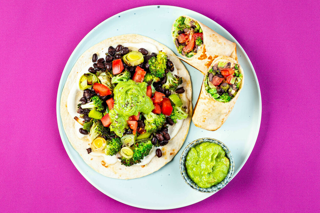 A prepared serving of broccoli and black bean burrito
