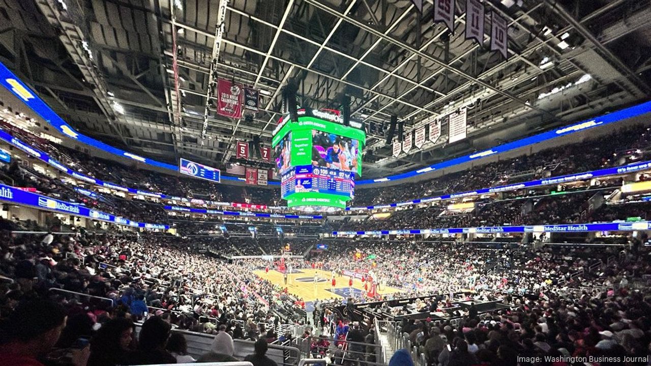 Basketball game underway inside Capital One Arena, with spectators filling the stands.