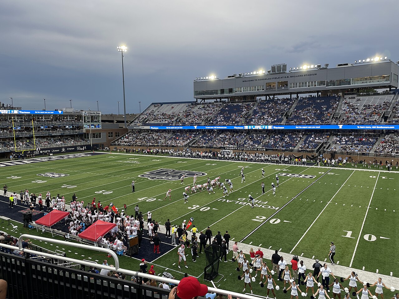 Old Dominion and Louisiana football teams line up on the field during a game at S.B. Ballard Stadium in Norfolk, Virginia, in 2023