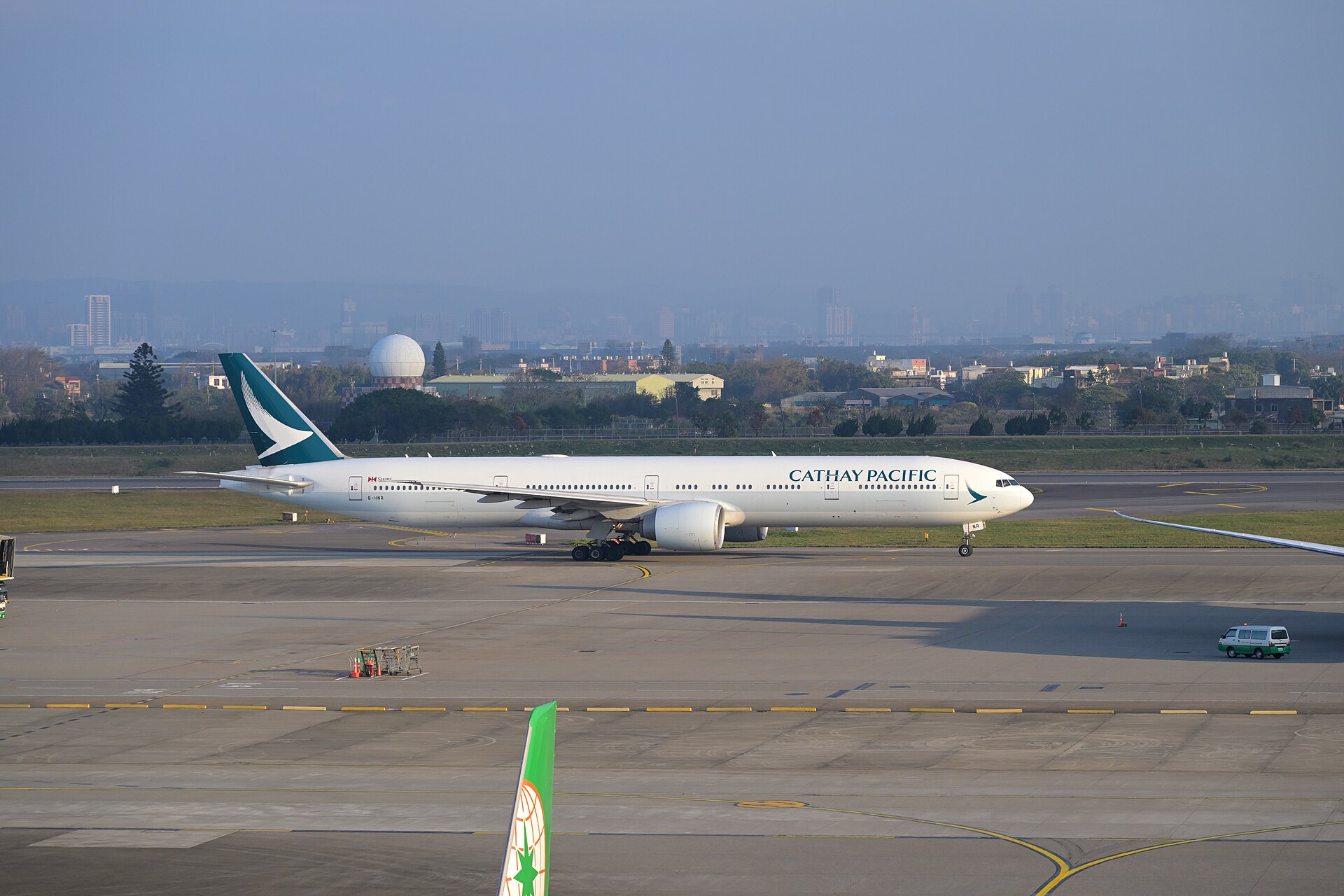 Cathay Pacific Boeing 777-300ER B-HNR taxiing for departure to Hong Kong at Taoyuan International Airport in February 2026
