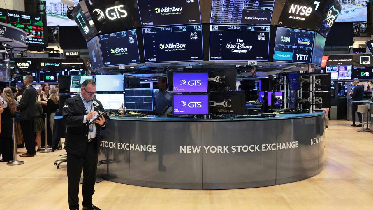 A trader works at a post on the New York Stock Exchange floor.