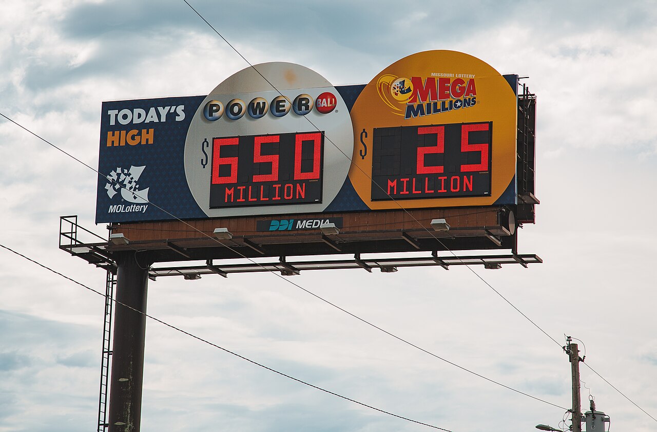 File photo from August 2017 of a Missouri billboard advertising Powerball and Mega Millions; displayed jackpots are historical