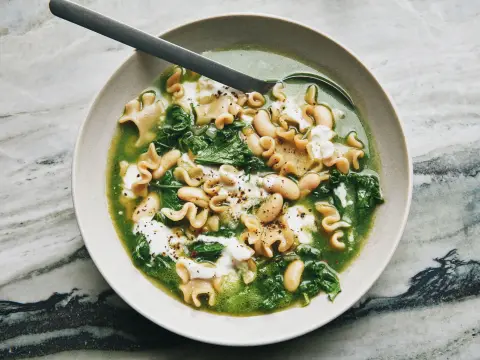 A prepared serving of kale, white bean and whole-grain pasta soup