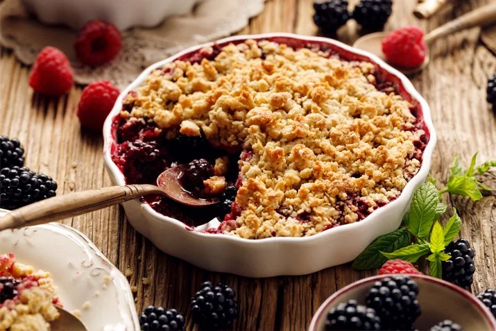 A prepared serving of oat-topped mixed berry crumble