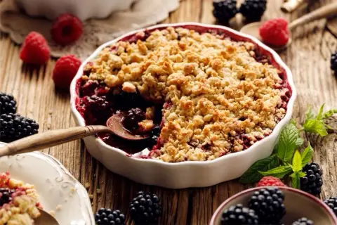 A prepared serving of oat-topped mixed berry crumble