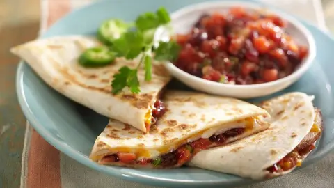 turkey quesadillas with cranberry salsa as a finished dish ready to serve.