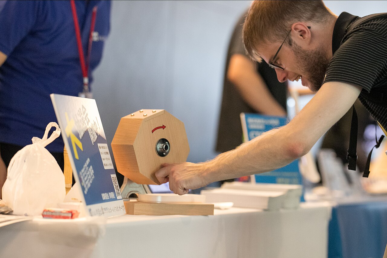 A revolving lottery draw machine at a public lottery event.